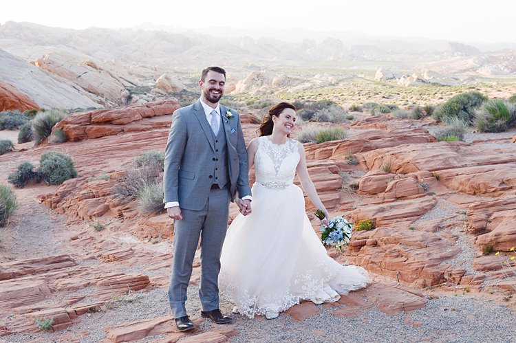 Bride Groom Laughing Pose Windy Valley of Fire Wedding Nevada https://cactusandlaceweddings.com/