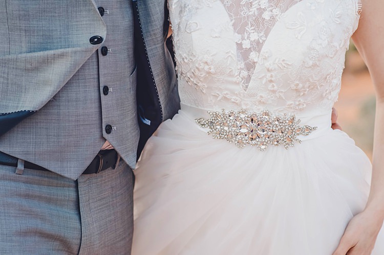 Bride Groom Waist Windy Valley of Fire Wedding Nevada https://cactusandlaceweddings.com/