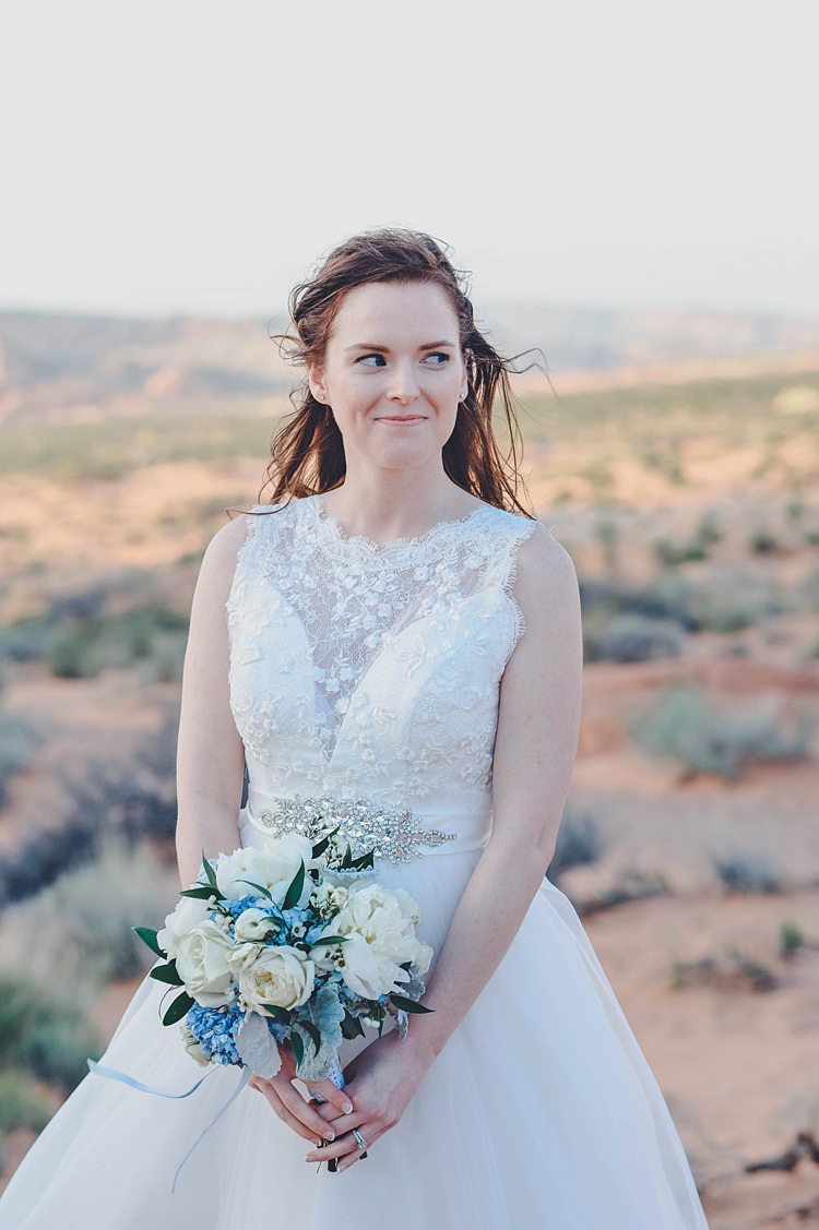 Bride Lace Dress Bouquet Blue Windy Valley of Fire Wedding Nevada https://cactusandlaceweddings.com/