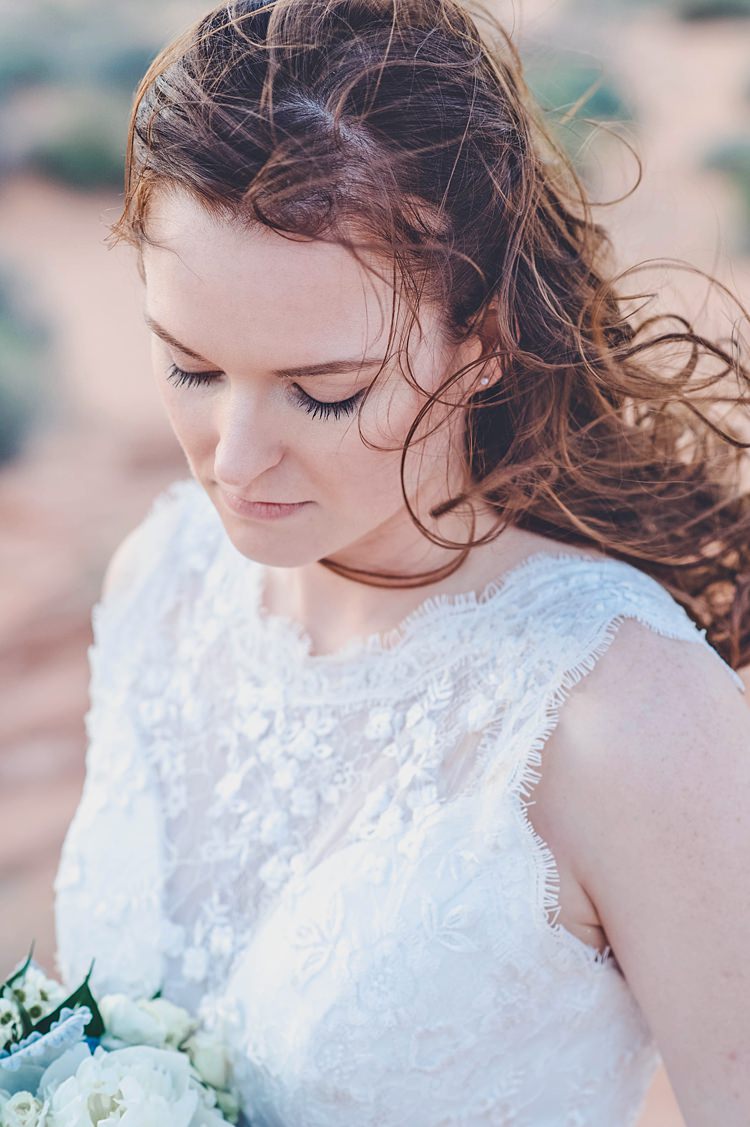 Bride Closeup Windy Valley of Fire Wedding Nevada https://cactusandlaceweddings.com/