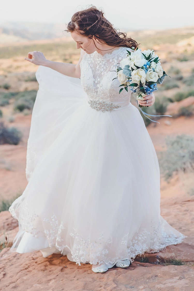 Bride Dress Bouquet Windy Valley of Fire Wedding Nevada https://cactusandlaceweddings.com/