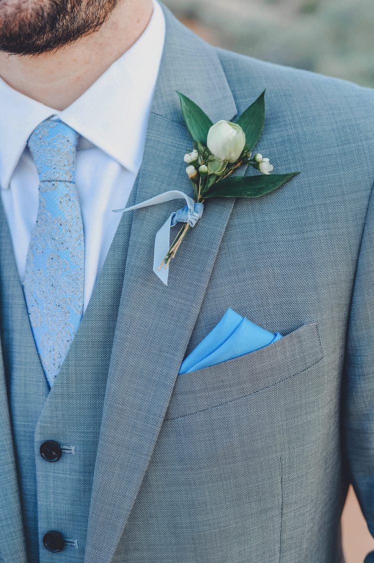 Groom Blue Grey Buttonhole Windy Valley of Fire Wedding Nevada https://cactusandlaceweddings.com/