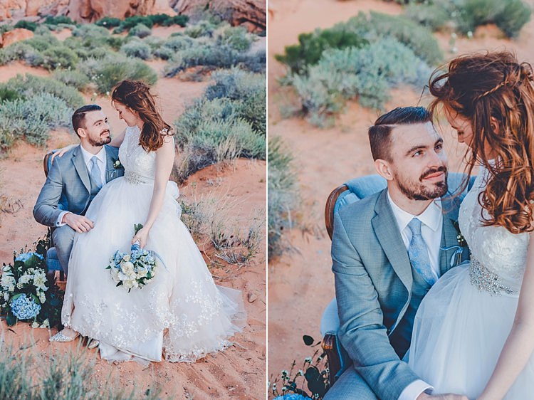 Bride Groom Sitting Lap Windy Valley of Fire Wedding Nevada https://cactusandlaceweddings.com/