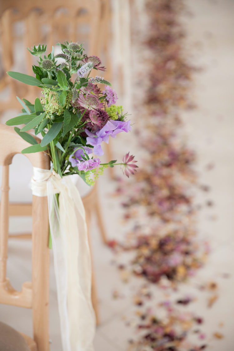Chair Pew End Aisle Flowers Ribbon Nigella Cornflowers Sweet Peas Stocks Scabious Rosemary Mint Purple Summer Festival Country Estate Wedding http://kerryannduffy.com/