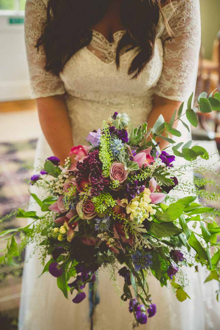 Bride Bridal Bouquet Multicoloured Rose Foliage Purple Pink Yellow Trailing Eclectic Floral Fun Wedding http://www.photographybypaloma.co.uk/