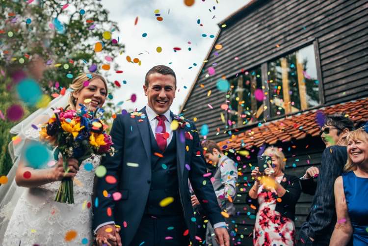 Confetti Throw Bride Groom Colourful Hand Made Rustic Barn Flower Filled Wedding http://www.threeflowersphotography.co.uk/