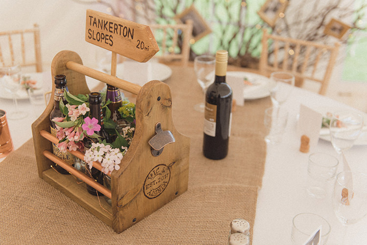 Table Centrepieces Wooden Crates Sign Post Table Names Flowers Beer Bottles Hessian DIY Rustic Woodland Marquee Wedding http://www.rebeccadouglas.co.uk/