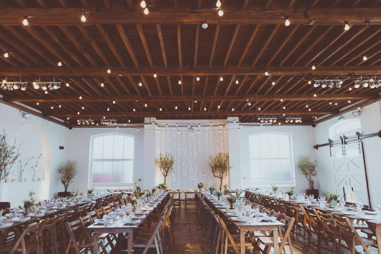 Festoon Lights Fairy Rustic Tables Urban Industrial Chic Warehouse Wedding http://sashaweddings.co.uk/