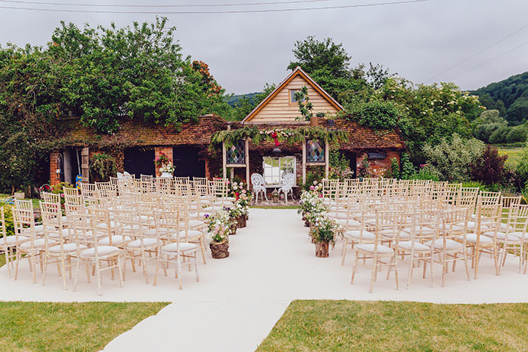 Ceremony Setup White Carpet Aisle Log Floral Arrangements Humanist Hand Made Orchard Garden Wedding http://www.curiousrosephotography.com/