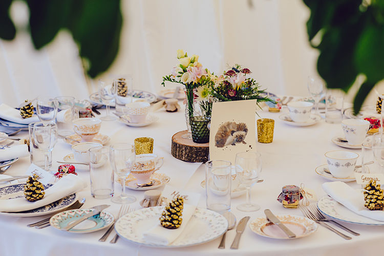 Table Setting Pine Cones Glitter Watercolour Number Centre Log Candles Floral Mismatched Crockery Humanist Hand Made Orchard Garden Wedding http://www.curiousrosephotography.com/