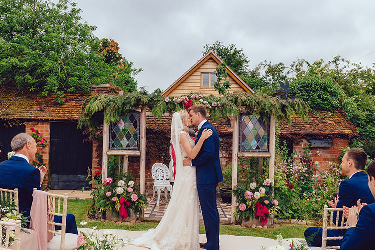 Ceremony Backdrop Floral Foliage Bride Bridal Maggie Sottero Dress Gown Veil Hair Vine French Connection Groom Suit Humanist Hand Made Orchard Garden Wedding http://www.curiousrosephotography.com/