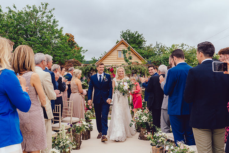 Aisle Log Arrangements Floral Bride Bridal Maggie Sottero Dress Gown Hair Vine French Connection Groom Suit Humanist Hand Made Orchard Garden Wedding http://www.curiousrosephotography.com/