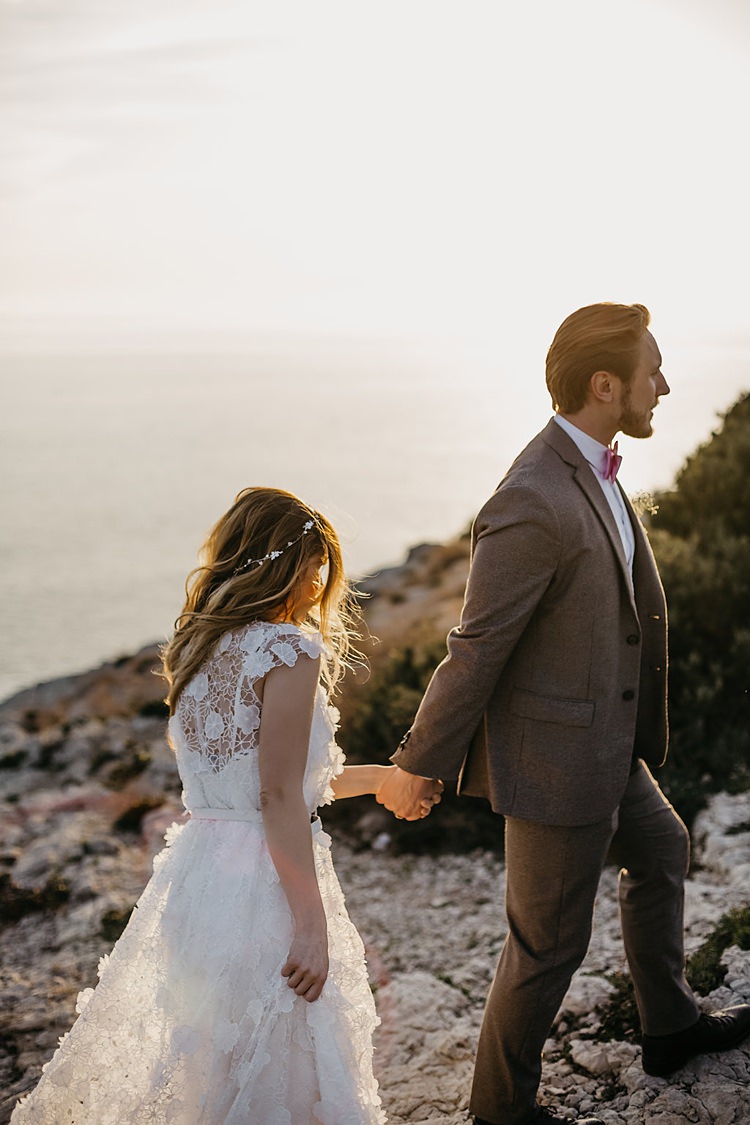 Bride Groom Climbing Cliff Whimsical Greenery Wedding Ideas Sea http://eglejo.lt/