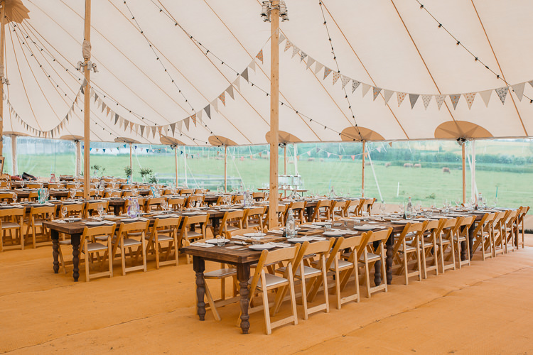 Sperry Tent wooden Chairs Table Rustic Bunting Festoon Lighting Outdoor Farm Wedding 1970s Dress https://www.magdak.co.uk/