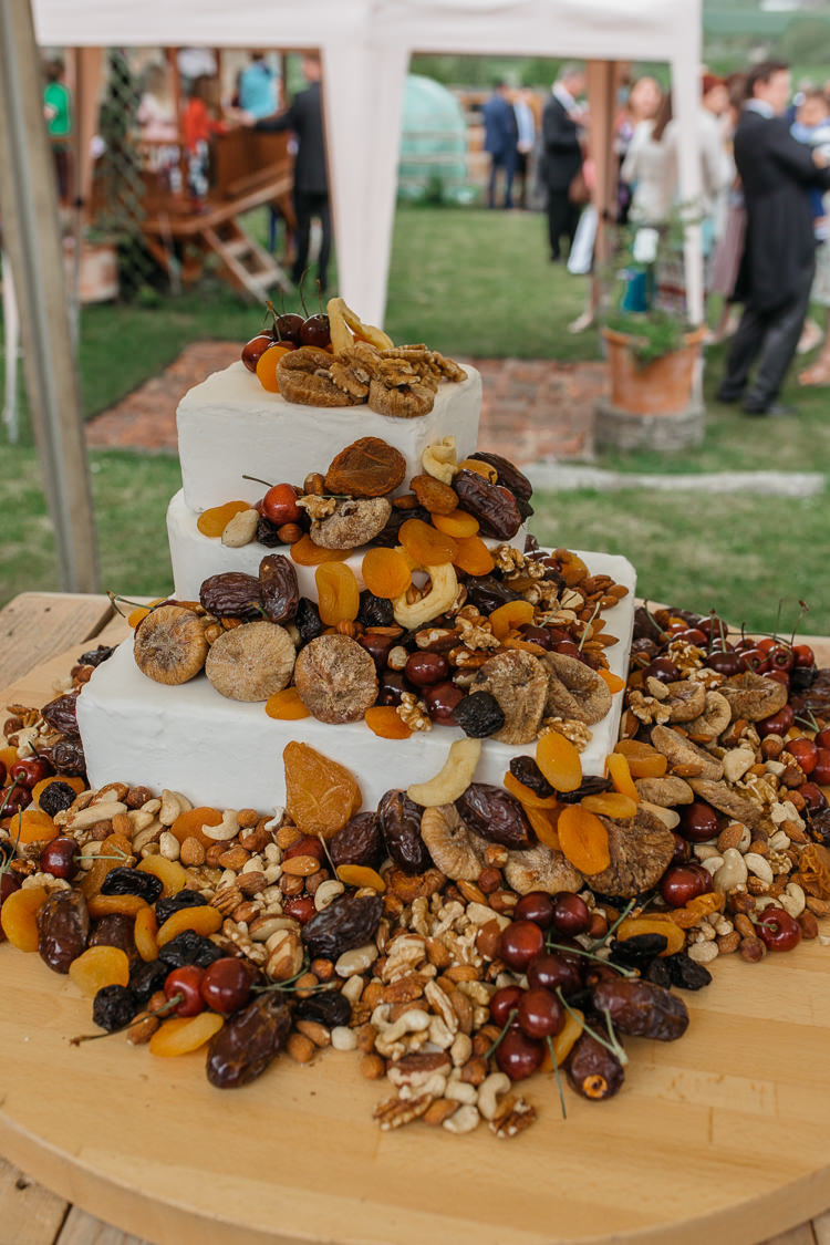 Cake Table Dried Fruit Cascade Outdoor Farm Wedding 1970s Dress https://www.magdak.co.uk/