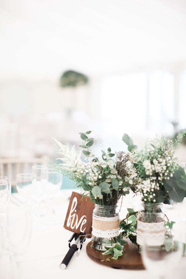 Log Centrepiece Wood Jars Hessian Lace Flowers Greenery Beautifully Authentic Rustic Country House Wedding https://www.nikkismoments.com/