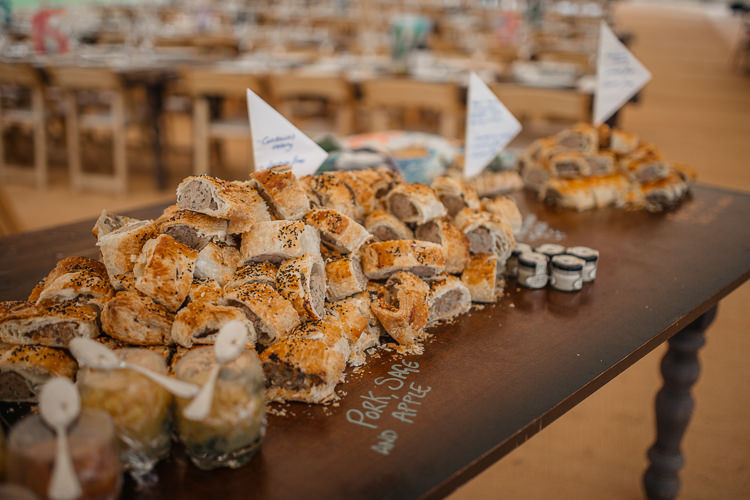 Sausage Rolls Rustic Buffet Wooden Table Picnic Ploughmans Outdoor Farm Wedding 1970s Dress https://www.magdak.co.uk/