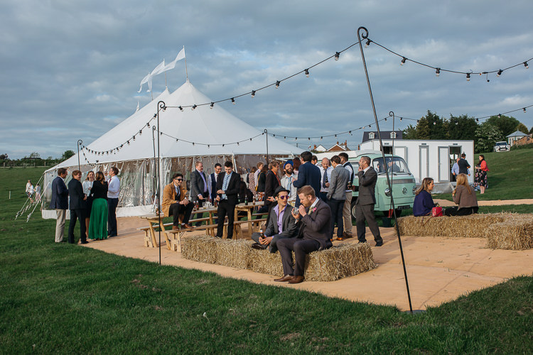 Papakata Sperry Tent Festoon Lighting Hay Bales Outdoor Farm Wedding 1970s Dress https://www.magdak.co.uk/