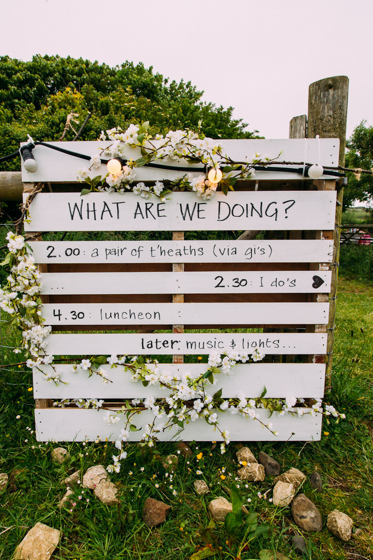 Pallet Sign Order of the Day Festoon Lighting Schedule Fun Laid Back DIY Rustic Marquee Wedding http://www.louisegriffinphotography.com/
