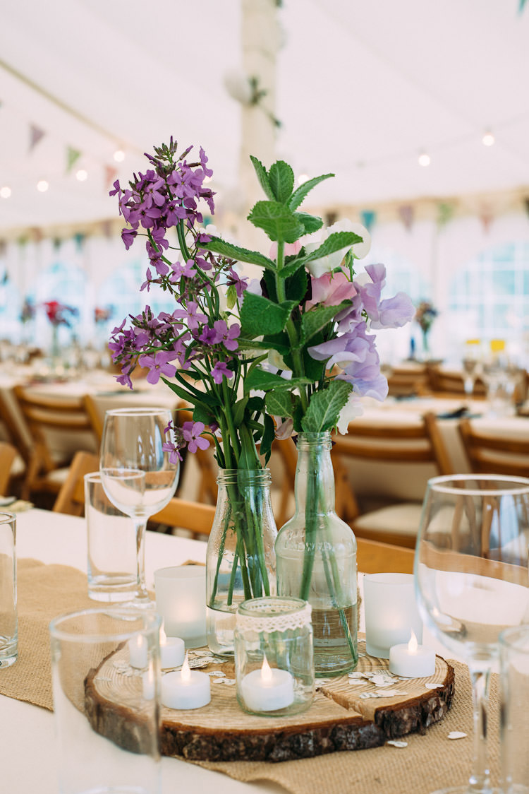 Glass Bottles Flowers Mint Jars Lace Burlap Hessian Table Runner Wood Slice Fun Laid Back DIY Rustic Marquee Wedding http://www.louisegriffinphotography.com/