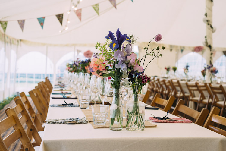 Mismatched Bottles Wild Flowers Burlap Hessian Runner Bunting Fun Laid Back DIY Rustic Marquee Wedding http://www.louisegriffinphotography.com/
