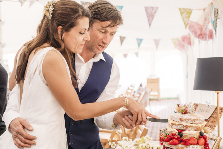 Cutting Naked Cake Charlie Brear Bride Reiss Groom Waistcoat Fun Laid Back DIY Rustic Marquee Wedding http://www.louisegriffinphotography.com/
