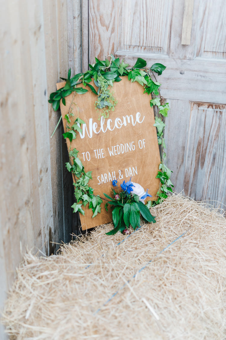 Wooden Painted Sign Calligraphy Greenery Foliage Whimsical Wedding Sea Rustic Barn http://sugarbirdphoto.co.uk/