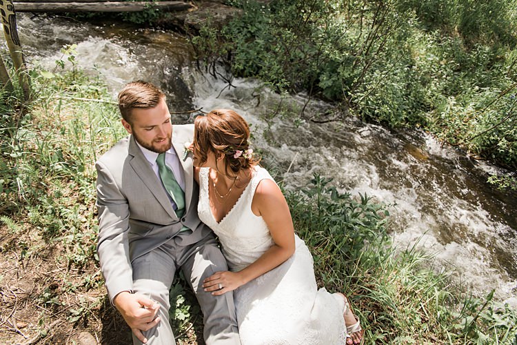 Bride Groom Sitting Stream Scenic Rocky Mountain National Park Elopement http://allisonslaterphotography.com/