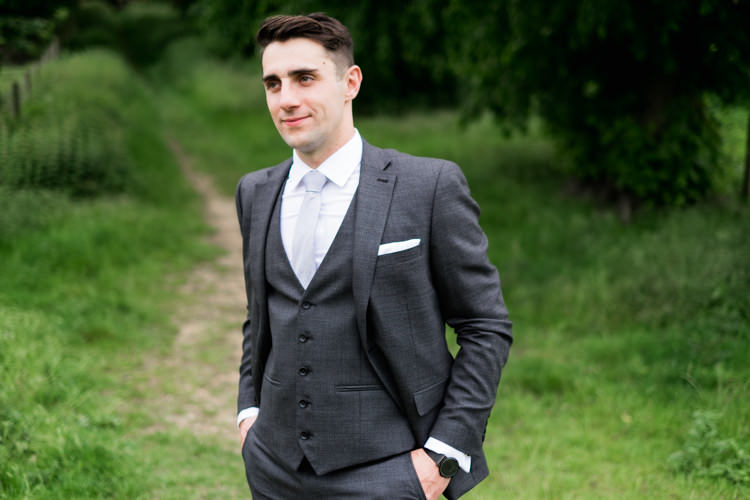 Grey Suit Groom Next Whimsical Unicorn Rainbow Wedding http://clairemacintyre.com/