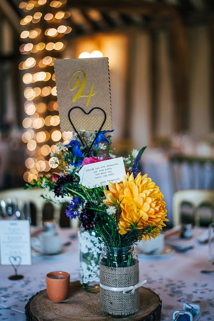 Centrepiece Jar Log Hessian Ribbon Colourful Hand Made Rustic Barn Flower Filled Wedding http://www.threeflowersphotography.co.uk/