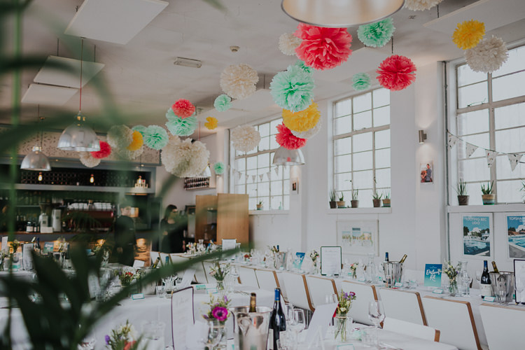 Table Setting Multicolour Tissue Paper Pom Pom Low Key Colour Pop Local City Wedding http://www.kategrayphotography.com/