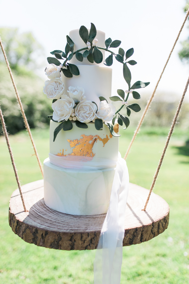 Marble Cake Wreath Gold Log Suspended Log Hanging Swing Bohemian Garden Greenery Wedding Ideas http://www.storytellerphotography.co.uk/