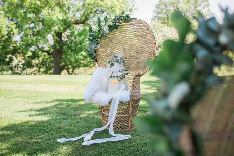 Wicker Chair Flowers Cake Stand Bohemian Garden Greenery Wedding Ideas http://www.storytellerphotography.co.uk/