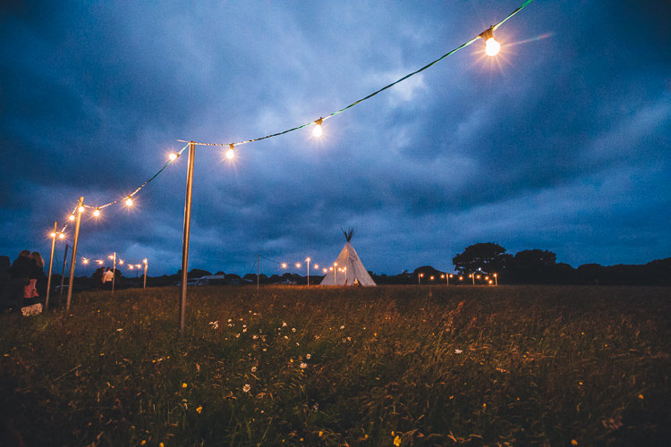 Festoon Lights Outdoors Large DIY Bohemian Tipi Party Wedding http://www.mikeplunkettphotography.com/