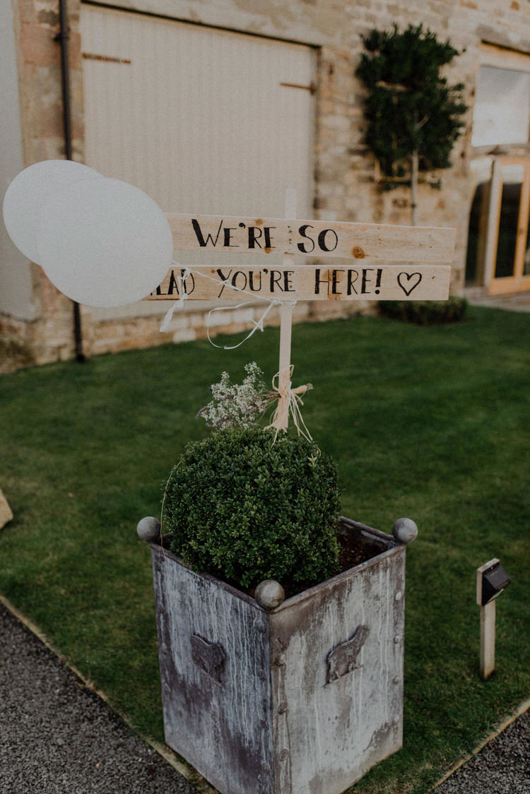 Painted Wooden Sign Balloons Dreamy Natural Boho Barn Wedding https://heychrisrandle.com/