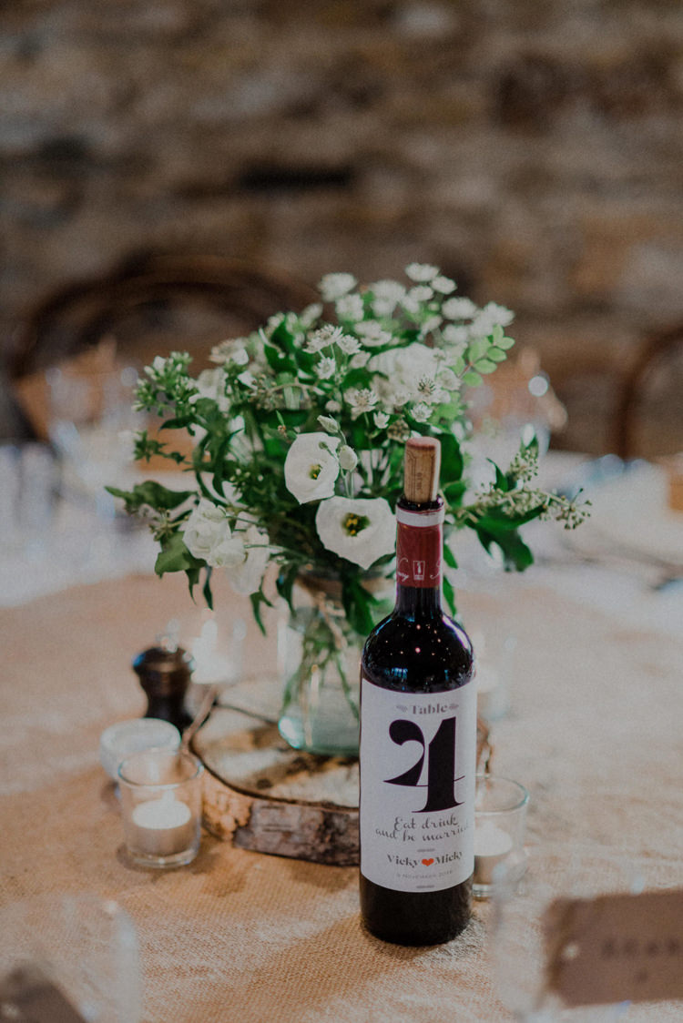 Centrepiece Flowers Log Hessian Wine Bottle Number Table Dreamy Natural Boho Barn Wedding https://heychrisrandle.com/