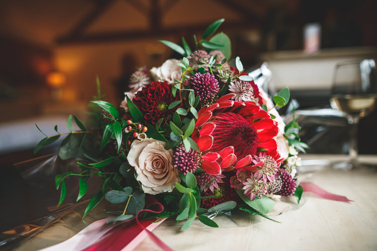 Bride Bridal Bouquet Rose Dhalia Greeenery Rustic Barn Red Gold Glam Wedding https://garethnewsteadphotography.com/