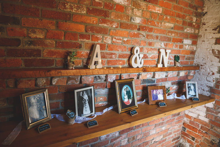 Wood Cut Letter Initial Family Photographs Fairy Lights Rustic Barn Red Gold Glam Wedding https://garethnewsteadphotography.com/