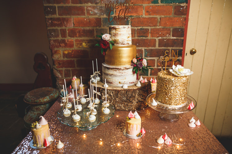 Cake Table Sequin Cloth Cake Pops Buttercream Naked Log Wood Slice Stand Meringue Kisses Fairy Lights Topper Laser Cut Rustic Barn Red Gold Glam Wedding https://garethnewsteadphotography.com/