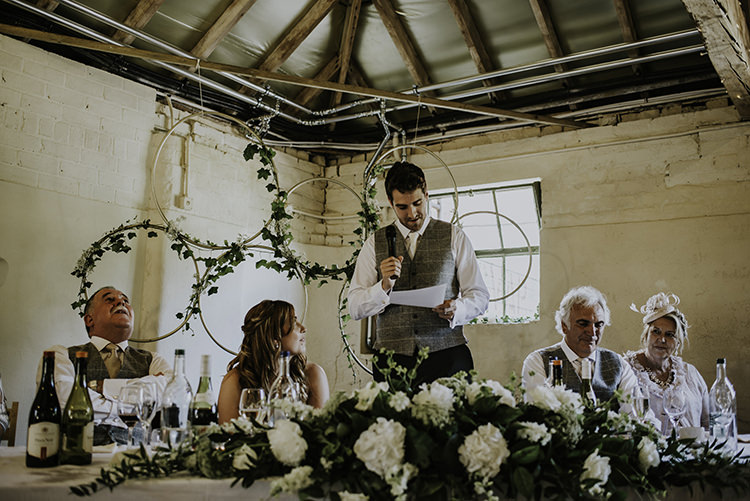 Hoop Greenery Backdrop Top Table Decor Enchanting Country Barn Wedding http://www.dmcclane.com/ 