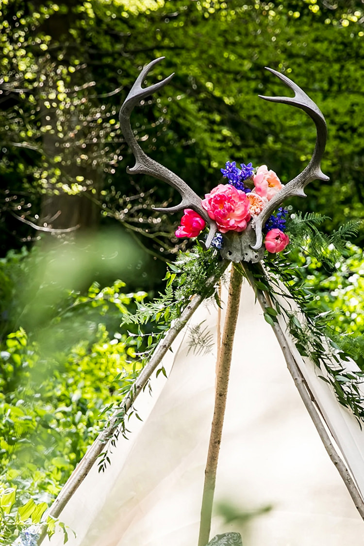 Tipi Tent Antlers Her Heart Was A Secret Garden Wedding Ideas Woodland Colourful Spring Bluebells Flowers http://sarabeaumontphotography.com/