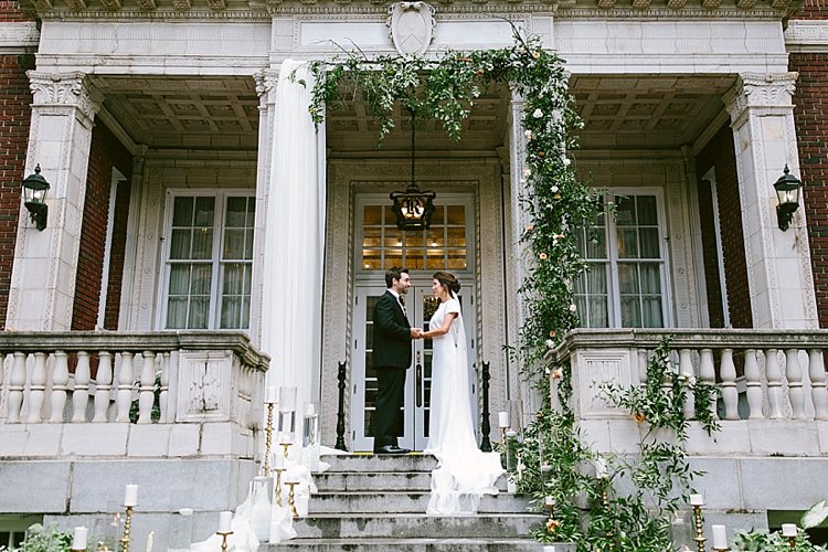 Bride Groom Steps Long Veil Plain Short Sleeved Dress Black Tie Gold Candles Greenery Modern Elegance Marble Greenery Gold Wedding Ideas http://www.jettwalkerphotography.com/