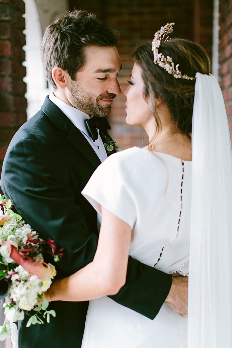 Black Tie Groom Bride Short Sleeve Plain Dress Buttons Long Veil Up Do Gold Tiara Headpiece Bouquet Roses Greenery Modern Elegance Marble Greenery Gold Wedding Ideas http://www.jettwalkerphotography.com/