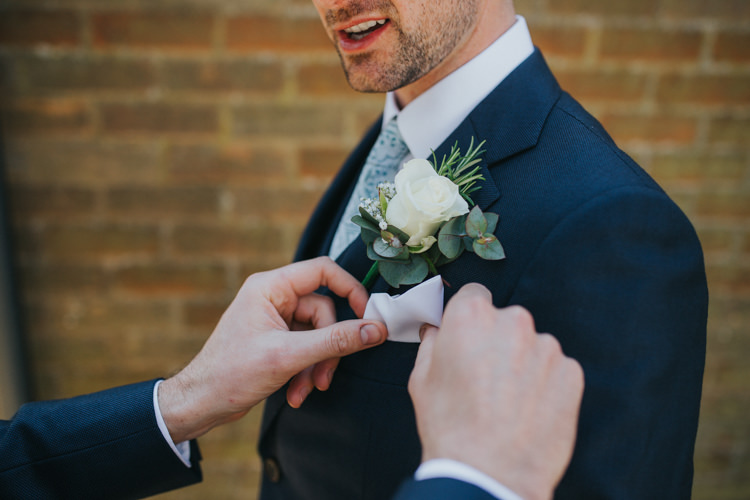 Buttonhole White Rose Groom Groomsmen Rosemary Eucalyptus Beautifully Serene Beachside Barn Wedding https://joshuapatrickphotography.com/