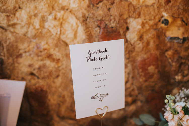 Guest Book Sign Photo Booth Polaroid Heart Clip Beautifully Serene Beachside Barn Wedding https://joshuapatrickphotography.com/
