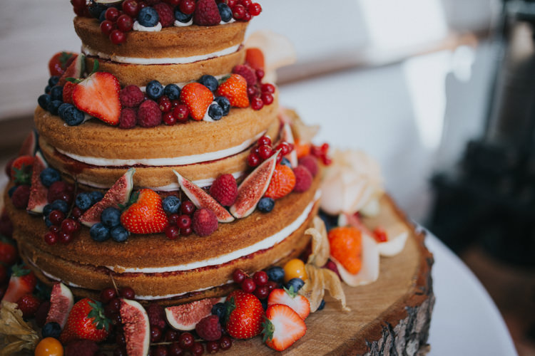 Naked Cake Berry Fruit Fig Log Stand Wood Slice Beautifully Serene Beachside Barn Wedding https://joshuapatrickphotography.com/