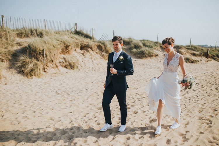 Bride Bridal Suzanne Neville Dress Gown Lace V Neck Suit Supply Groom Couples Portrait Trainers Beautifully Serene Beachside Barn Wedding https://joshuapatrickphotography.com/