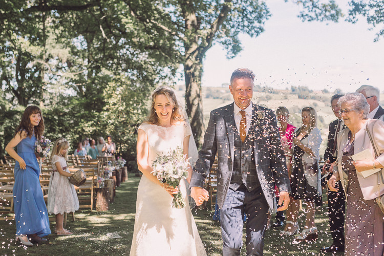 Kate Walker Bride Bridal Dress Gown Moss Bros Groom Tweed Three Piece Waistcoat Confetti Shot Moment Relaxed Outdoor Marquee Farm Wedding http://www.jenniferjanephotography.co.uk/