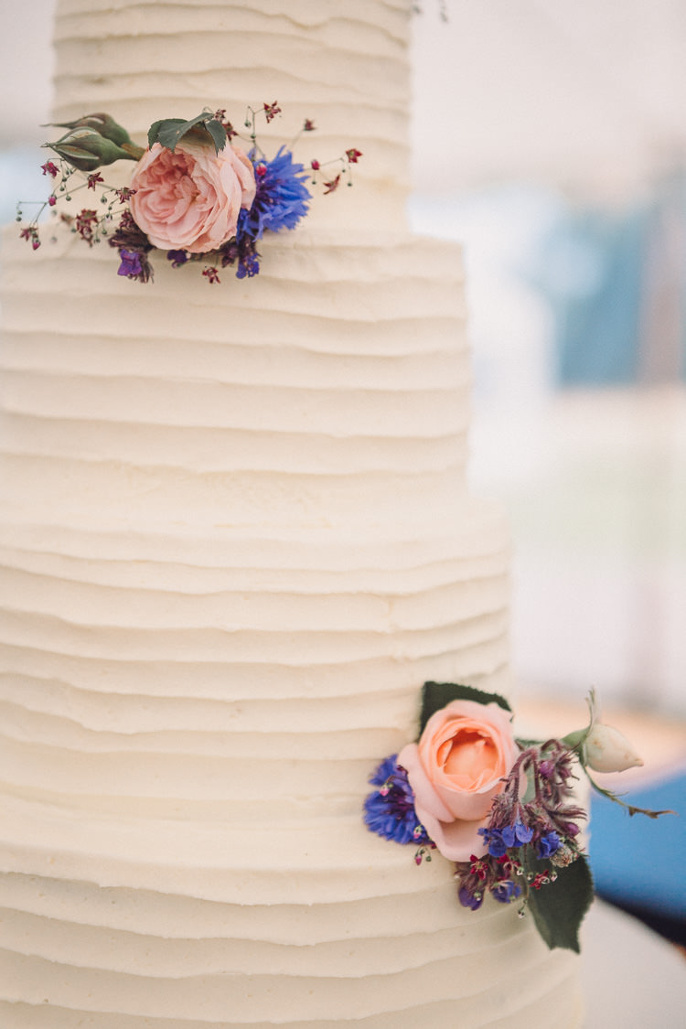 Buttercream Four Tier Cake Flowers Roses Relaxed Outdoor Marquee Farm Wedding http://www.jenniferjanephotography.co.uk/