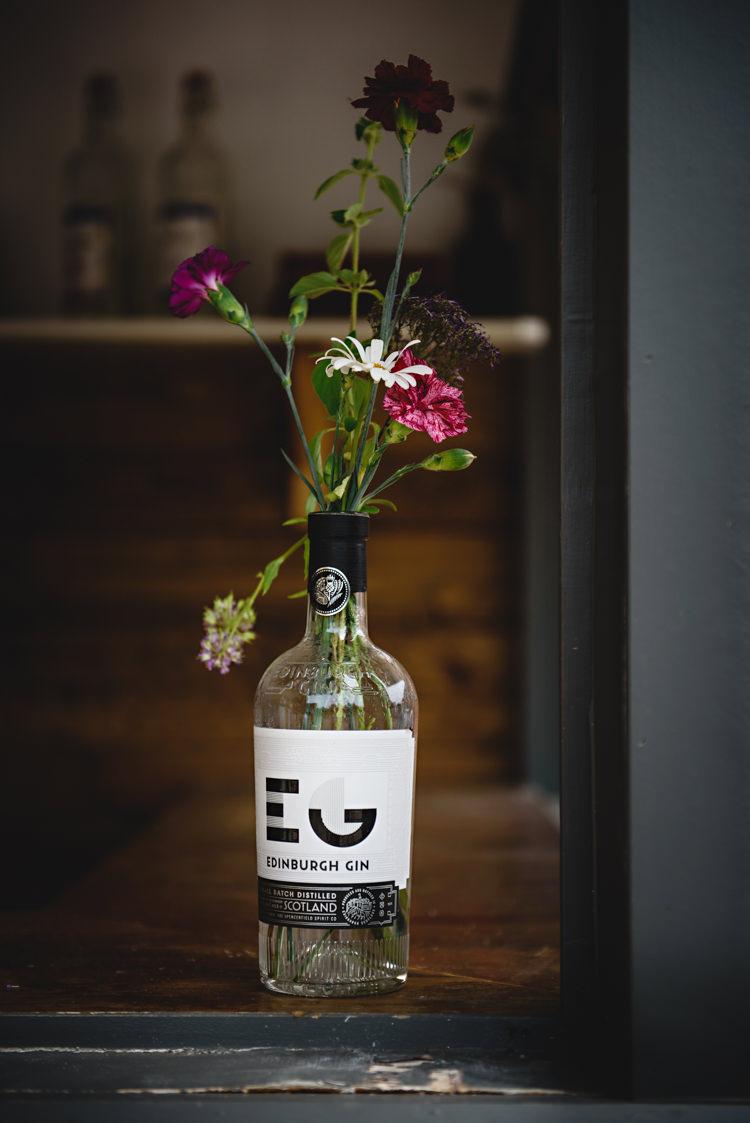 Flowers Gin Bottle Industrial Rose Gold Dove Grey Greenery Wedding http://hbaphotography.com/